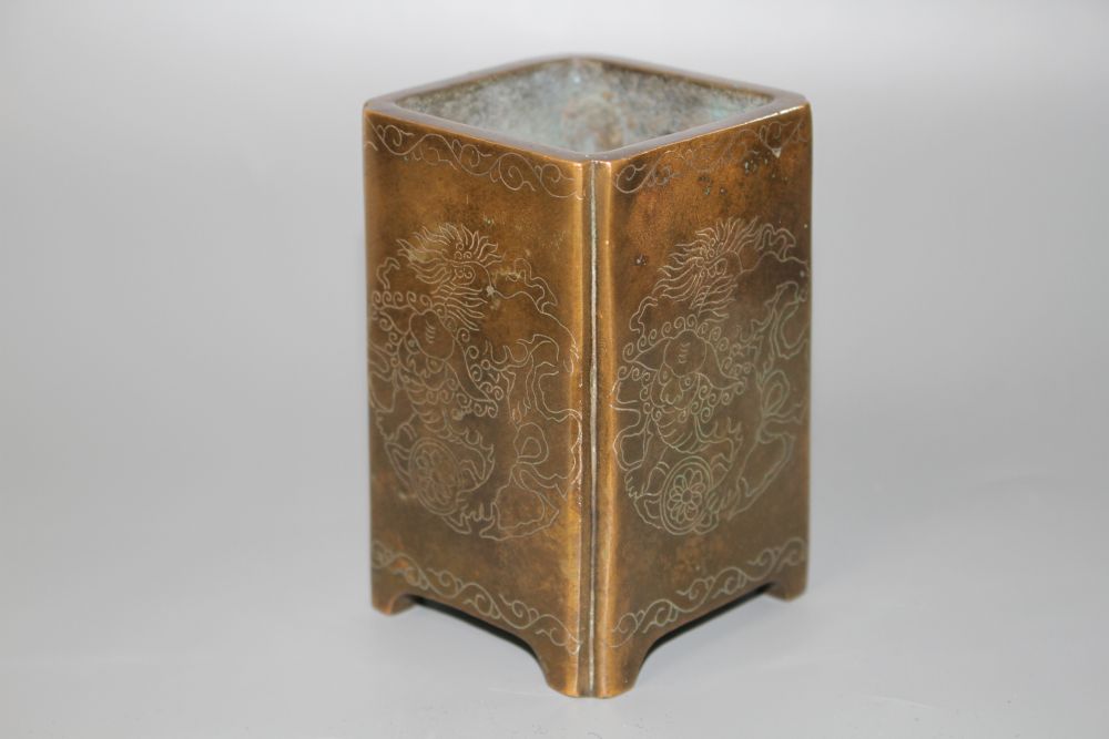 A Chinese bronze and silver inlaid square brush pot,